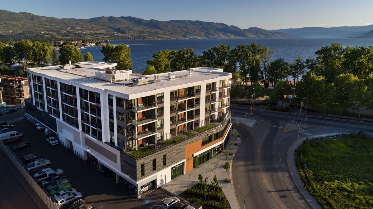Exterior of Kelowna Vacation Rental at The Shore Kelowna with Gyro Beach in the backround