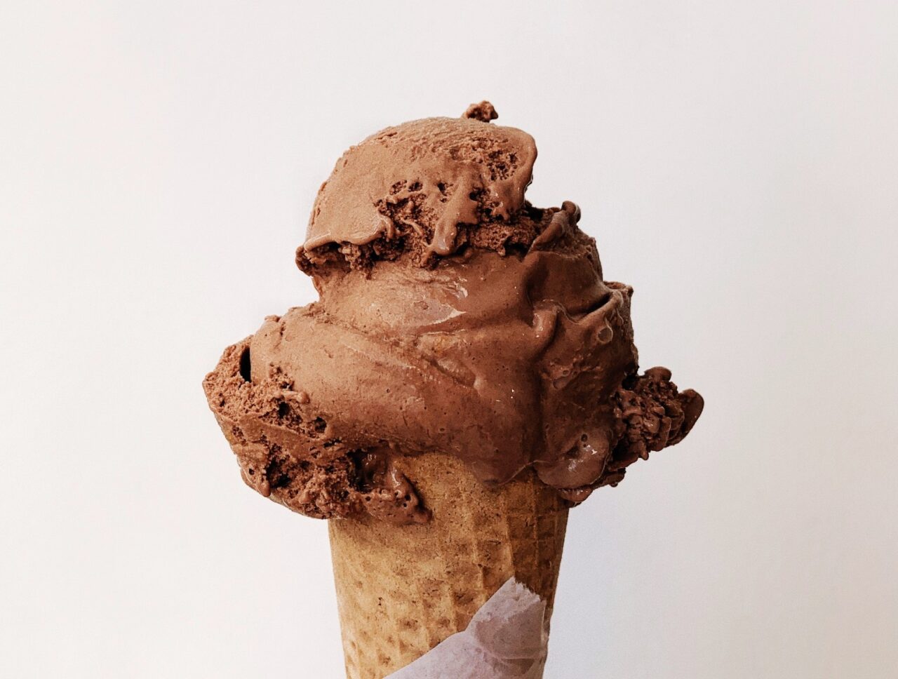 a chocolate ice cream scoop in a waffle cone at Parlour, some of the best ice cream in kelowna