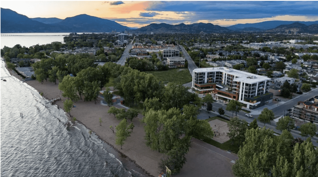 an aerial exterior view of The Shore Kelowna showing gyro beach and okanagan lake in the foreground