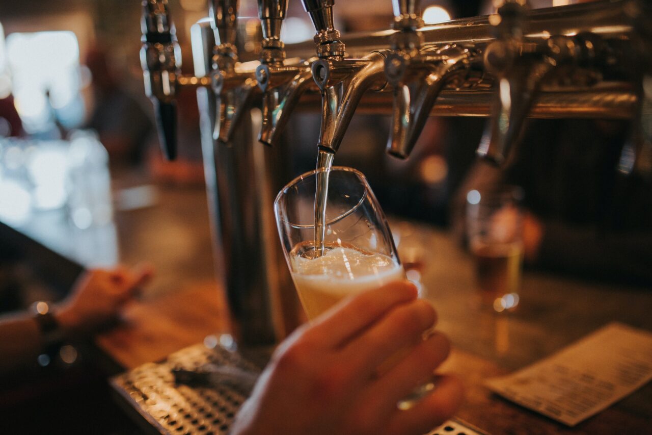 beer being poured from a tap at Kelowna's Train Station Pub