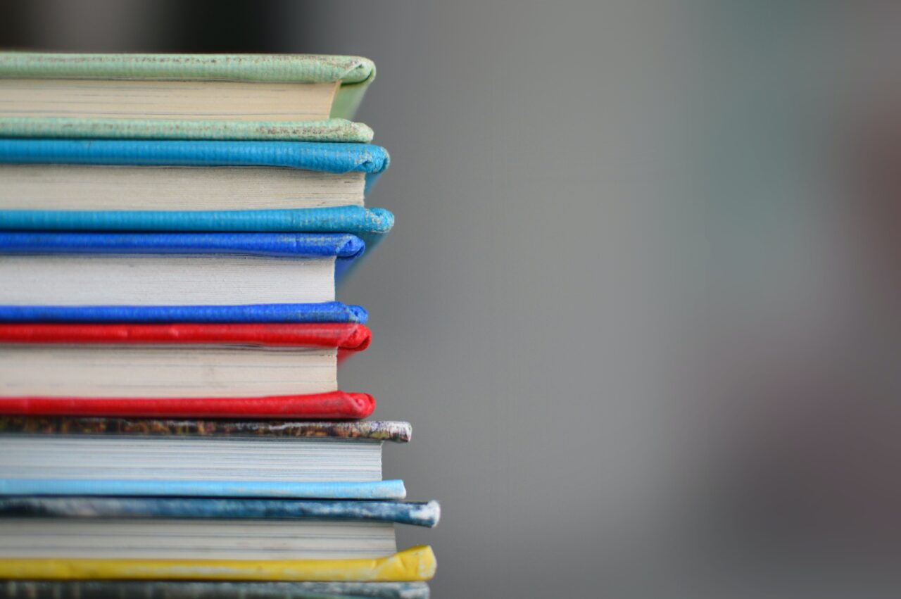 a pile of books from Robbie Rare books in Kelowna