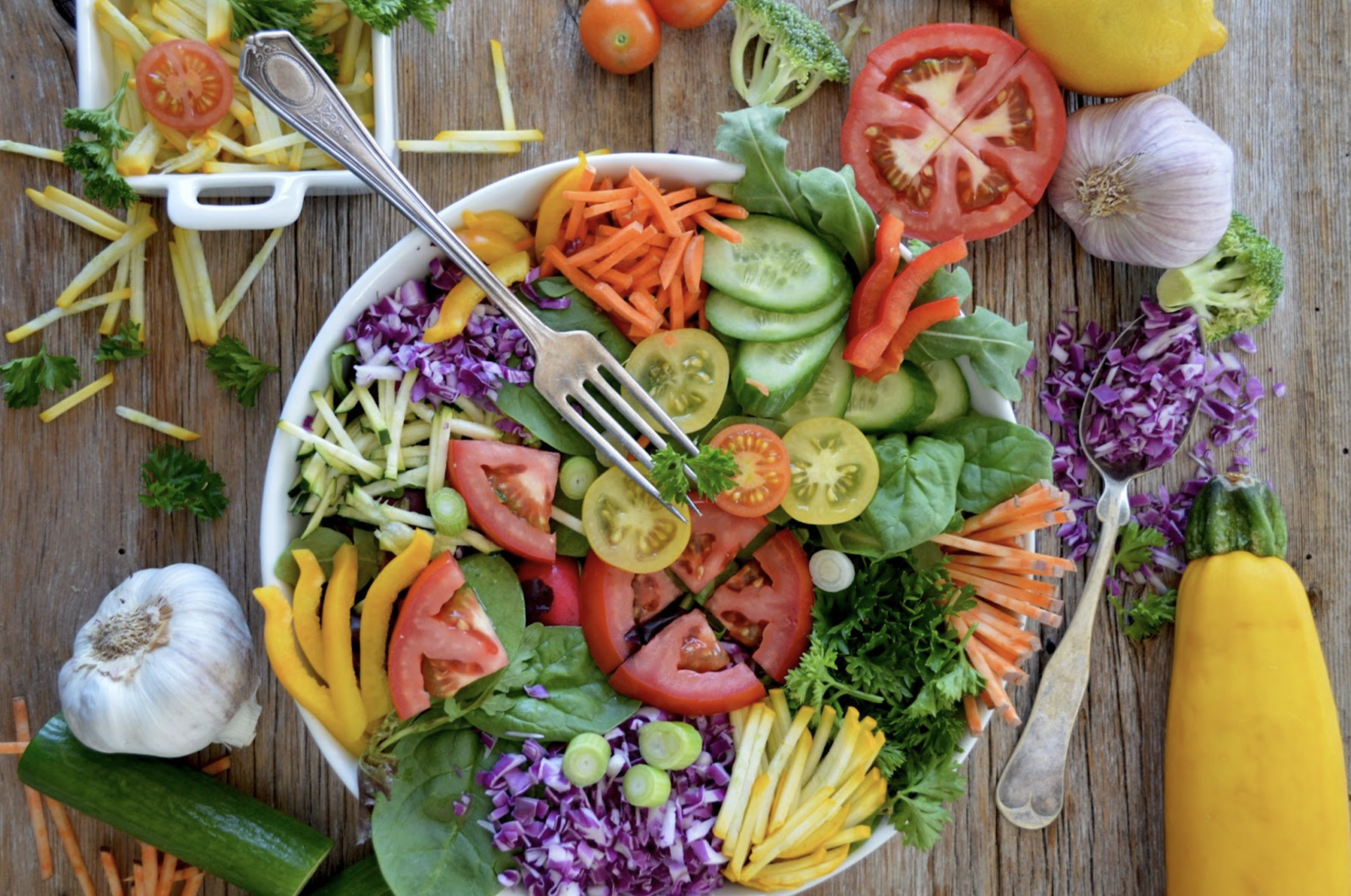 a top-down view of one of Kelowna's best salads, with an assortment of veggies on a bed of greens