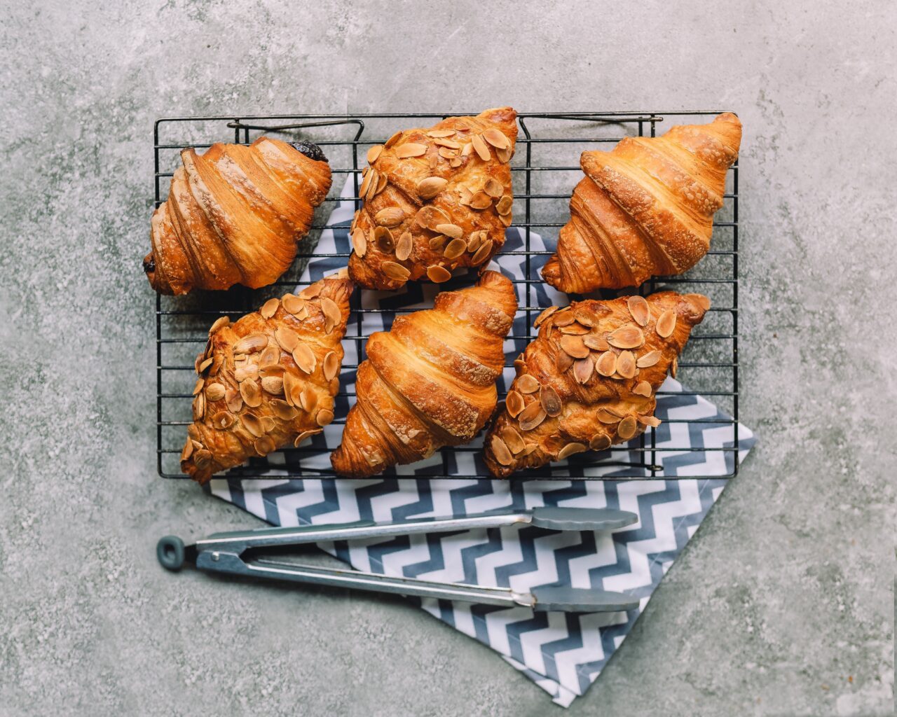 freshly bakes croissants at one of kelowna's best bakeries, on a concrete countertop