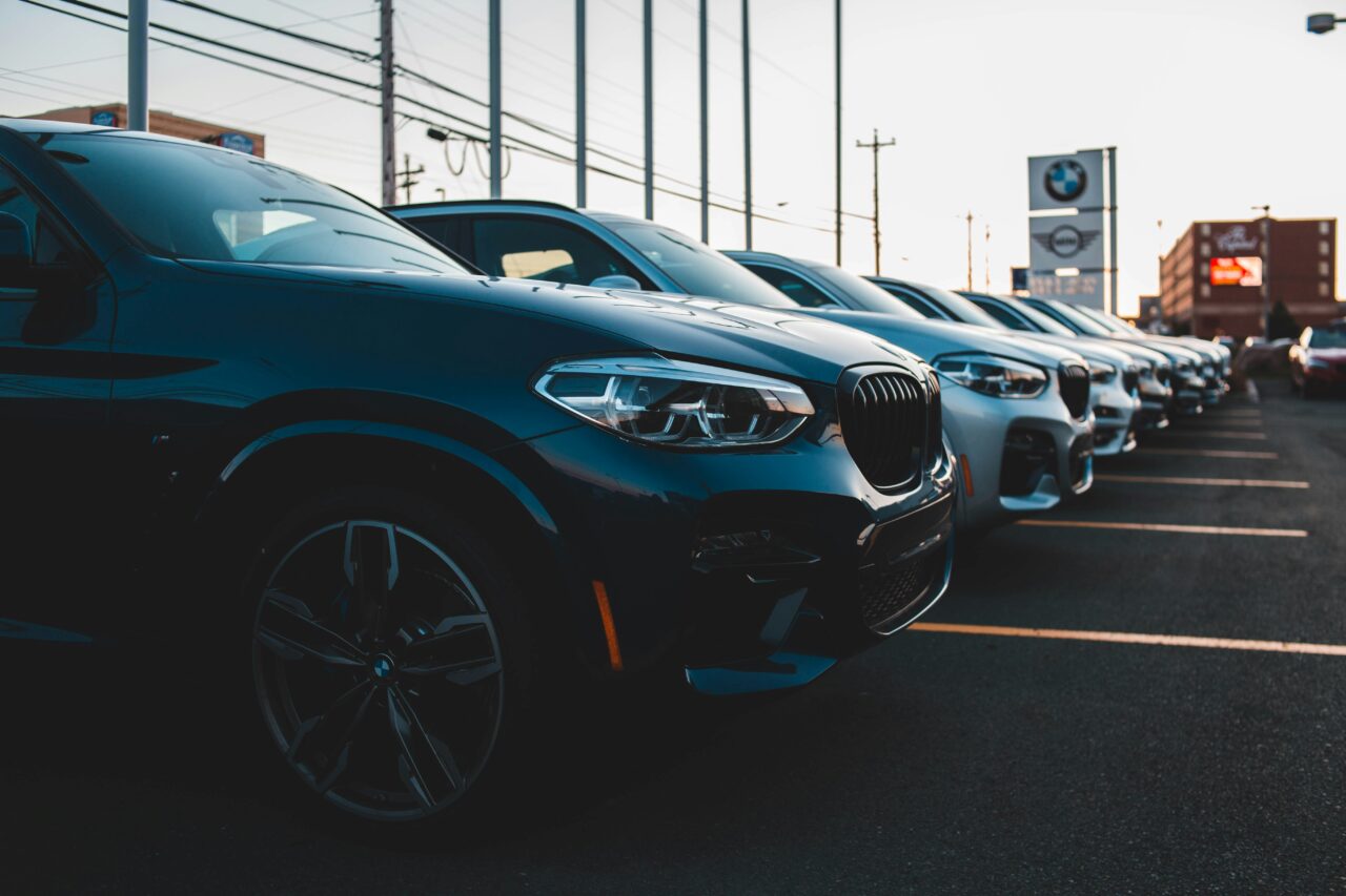 new cars lined up at a BMW car dealership