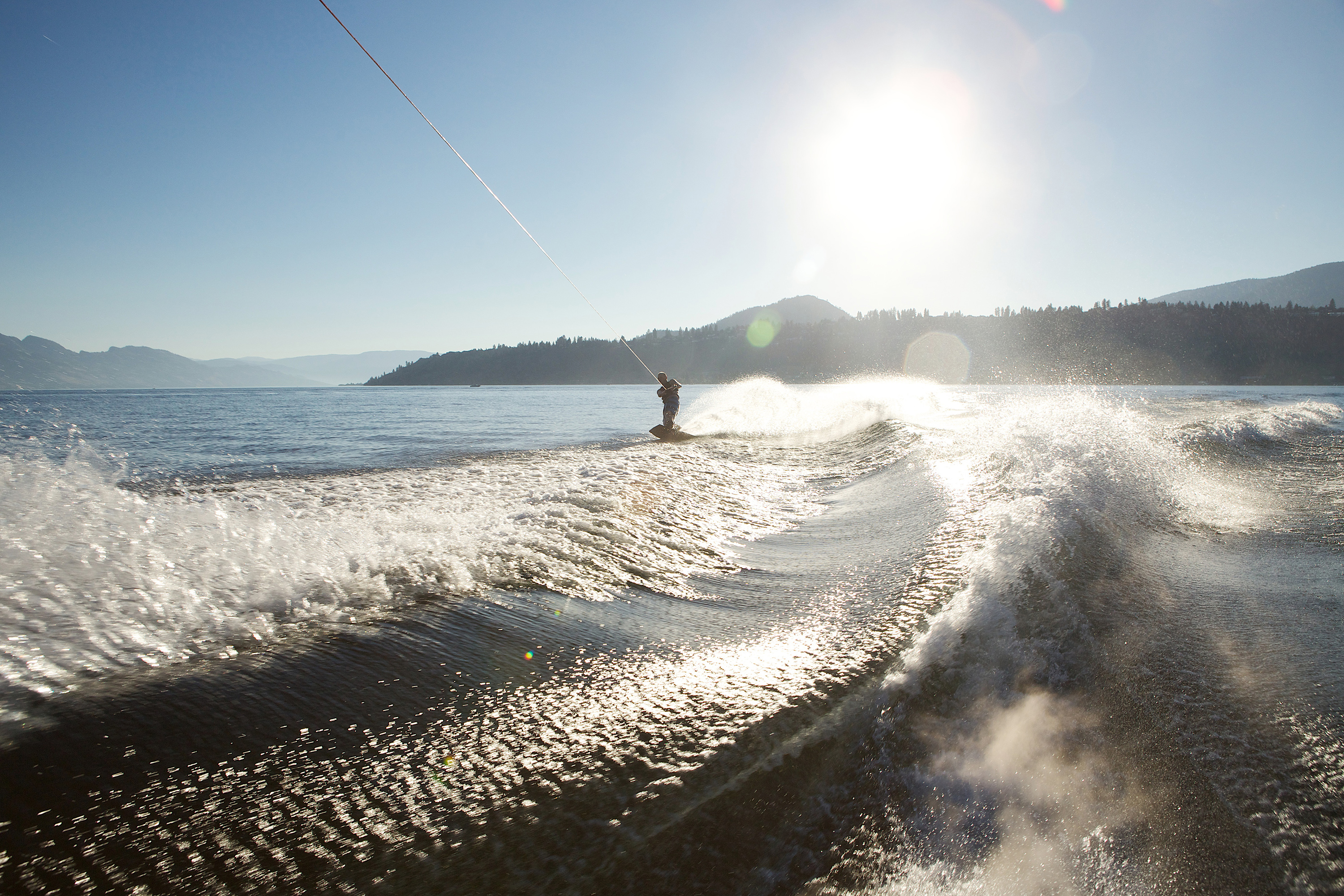 a wakeboarder on Okanagan lake, one of the popular summer sports in Kelowna