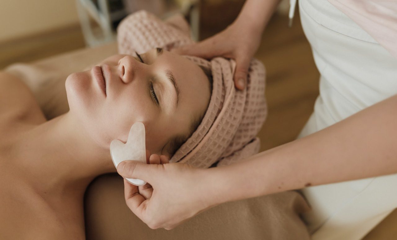 a woman getting pampered with a facial beauty treatment in Kelowna while staying at the Shore