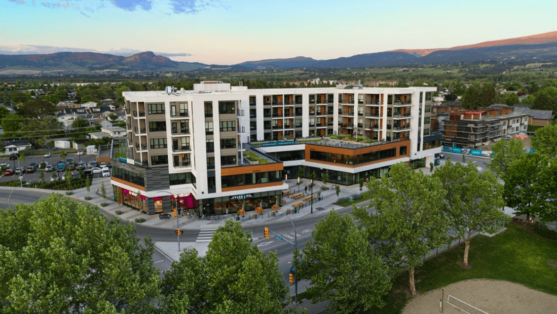 an exterior view of The Shore Kelowna with Shoreline brewing on the ground level