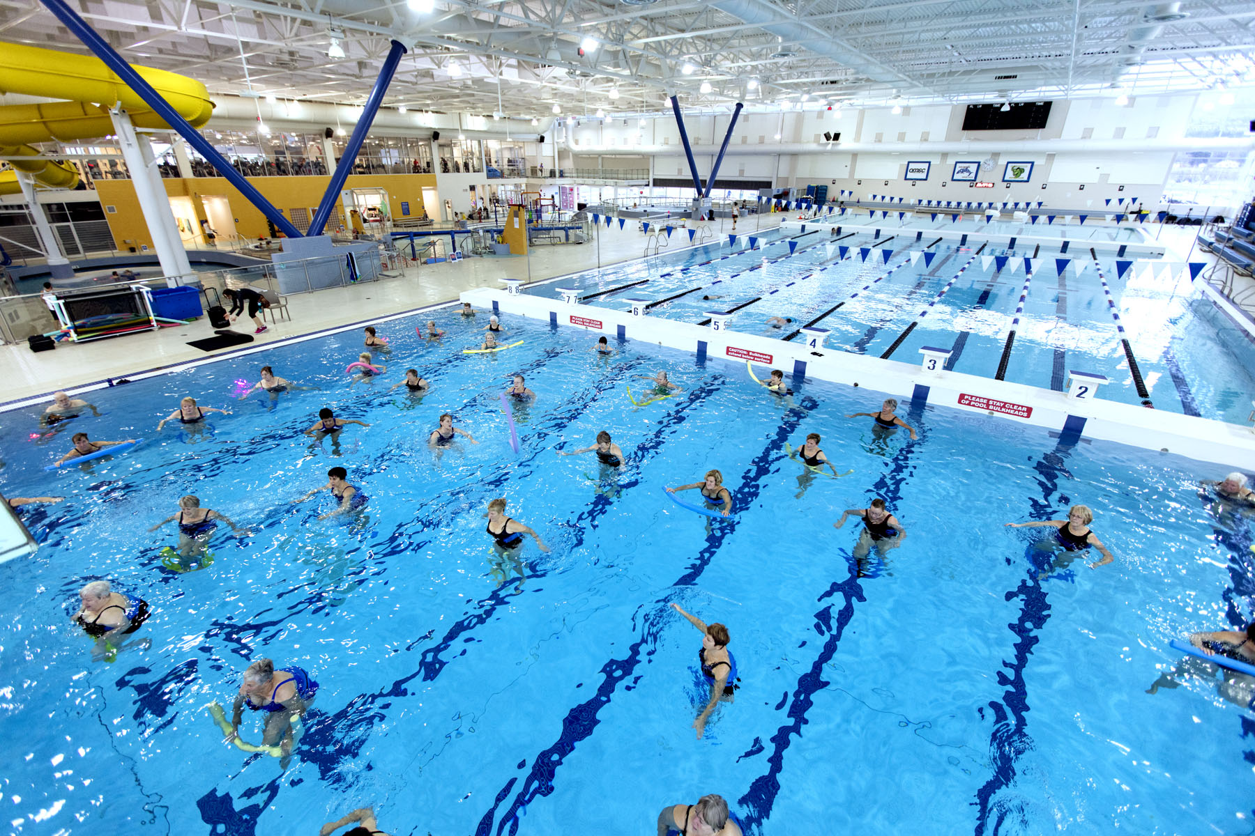 the kelowna h20 pool facility with an aquafit class happening in the foreground and pool space in the background